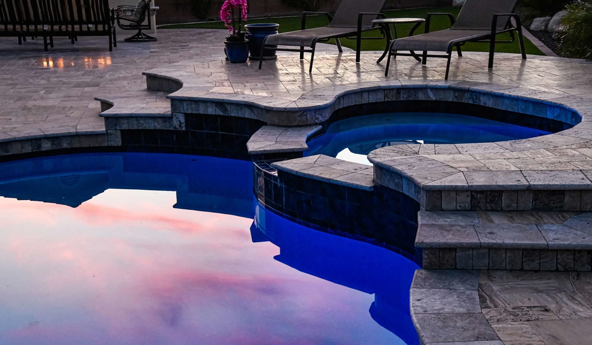 pool-with-hot-tub-reflecting-dark-blue-sky